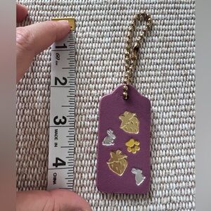NEW Coach Purple Leather Luggage Tag Strawberry Bunny Paw Print Bag Charm